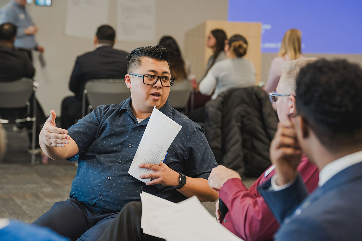 Elevate hennepin advisor noah discussing business