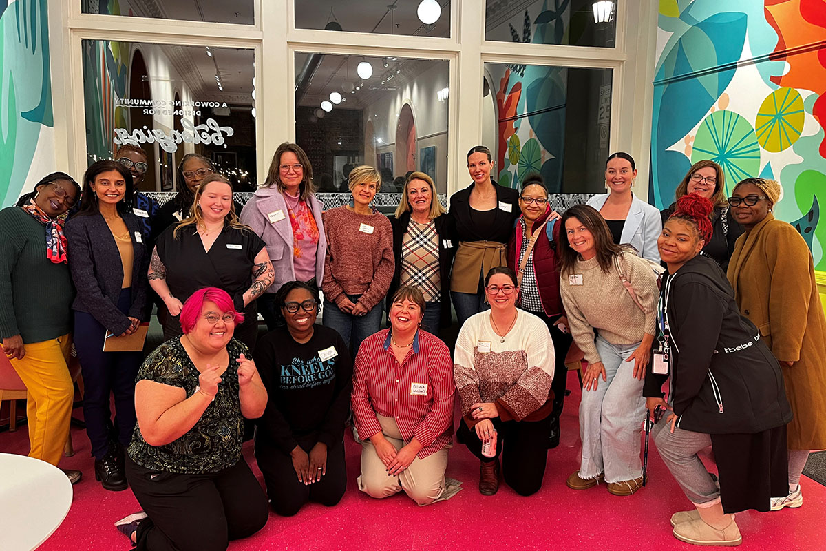 WomenVenture's Emily Conroy (in the blue blazer second from left) with a group of advisees. 